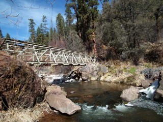 A bridge over the Jemez River leads to Spence Hot Springs.