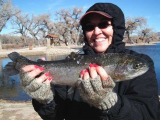 Joyce Maldonado, 44, of Albuquerque, shows off one of many fat trout she caught during a mid-winter's outing to Sandia Lakes.