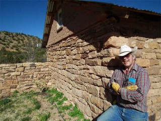 Bob Dolson leans on the goat barn he converted into his studio at his home in the tiny village of Villanueva on the Pecos River between Santa Fe and Las Vegas, New Mexico.