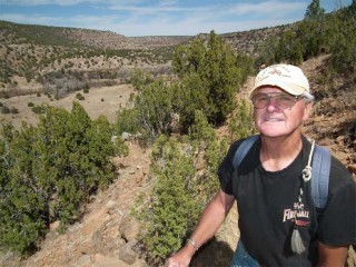 Pat Lambert, a railroad retiree from of Sheridan, Wyoming, enjoys an early spring hike up the overlook trail at Villanueva State park in New Mexico.