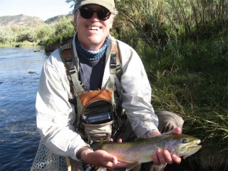 Angler Thom Cole of Santa Fe shows off a typical San Juan River Trout.