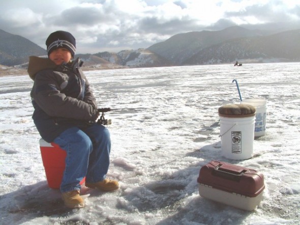 Adam Vigil, 7, of Taos waits patiently for a bite while ice fishing with his family at Eagle Nest Lake on Saturday, Jan.5, 2008.