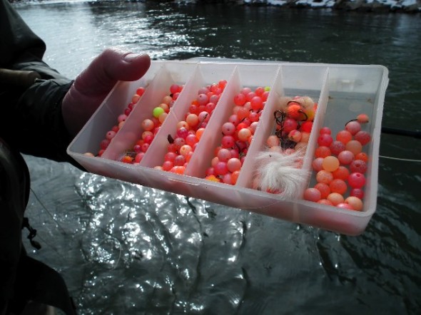 A fly box full of brightly colored egg patterns.