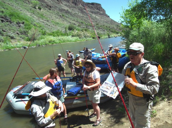 Renowned author of "Fishing in New Mexico" Ti Piper who has been teaching kids and adults how to fish for the New Mexico Department of Game and Fish (NMDGF) for years provides instruction on lures to Project Wild Participants during an outing to the Rio Grande in June, 2012.