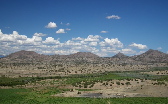 The view east from Galisteo Dam shows the backside of nearby Cerrillos Hills State Park.