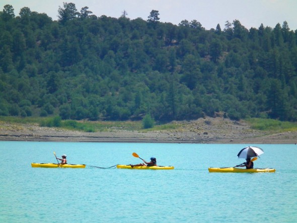 kayakers paddling across Heron Lake