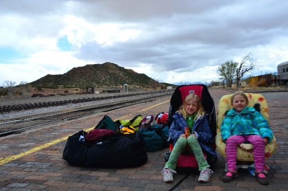 Kids in car seats wait fro train at Lamy NM