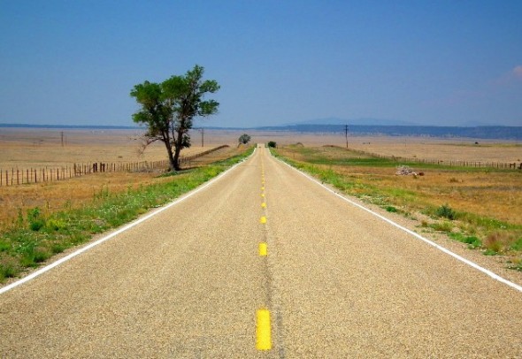 A long lonely stretch of two lane black top on the plains of eastern New Mexico. 