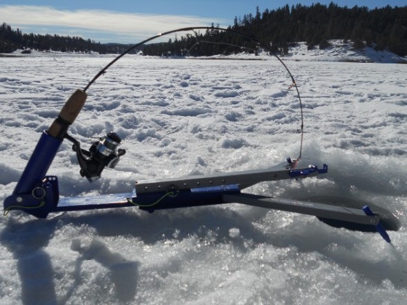 The hands free Jawjacker ice fishing device set up over a ice fishing hole on a lake somewhere in New Mexico. 